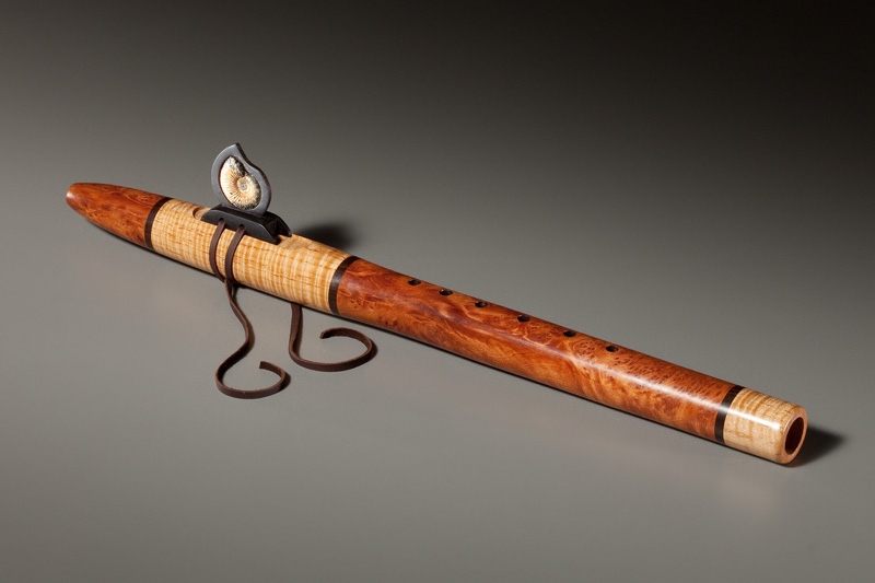 Instrument in the tradition of Native American flute with shell fetish